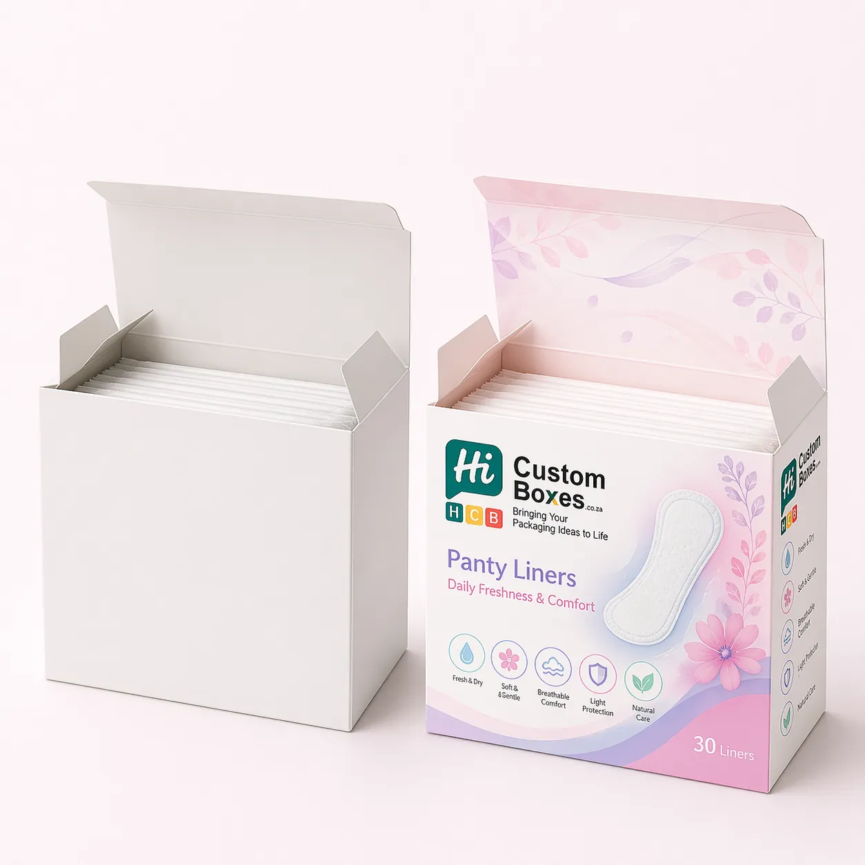 Two top-opening boxes, one plain and one printed with purple floral patterns and feminine care branding.